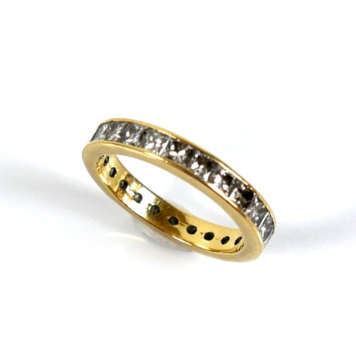 310 - An 18ct yellow gold and diamond full eternity ring, set with twenty five princess cut stones, each a... 