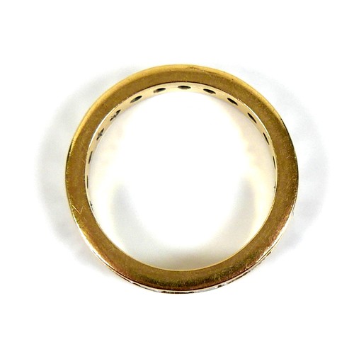 310 - An 18ct yellow gold and diamond full eternity ring, set with twenty five princess cut stones, each a... 