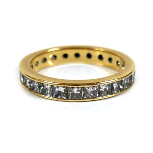 310 - An 18ct yellow gold and diamond full eternity ring, set with twenty five princess cut stones, each a... 