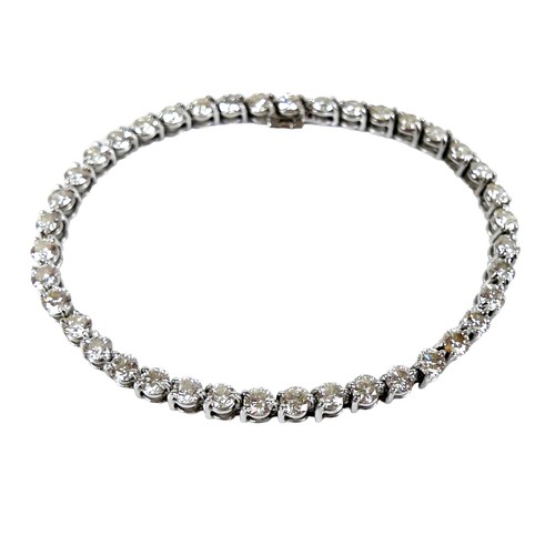 311 - An 18ct white gold and diamond tennis bracelet, set with forty round brilliant cut stones, each appr... 