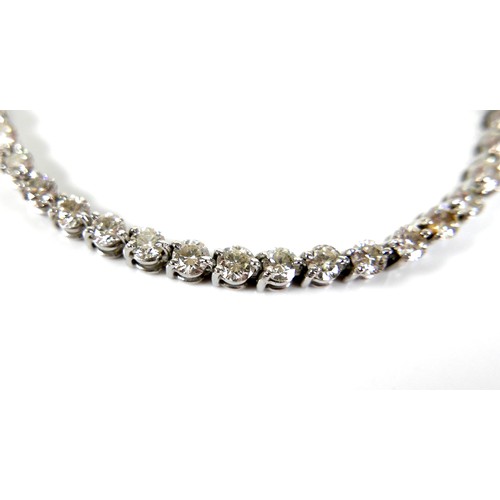 311 - An 18ct white gold and diamond tennis bracelet, set with forty round brilliant cut stones, each appr... 