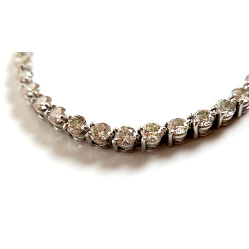 311 - An 18ct white gold and diamond tennis bracelet, set with forty round brilliant cut stones, each appr... 