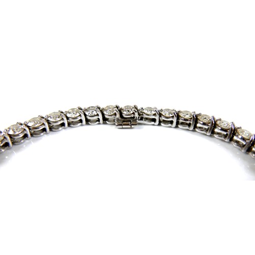 311 - An 18ct white gold and diamond tennis bracelet, set with forty round brilliant cut stones, each appr... 