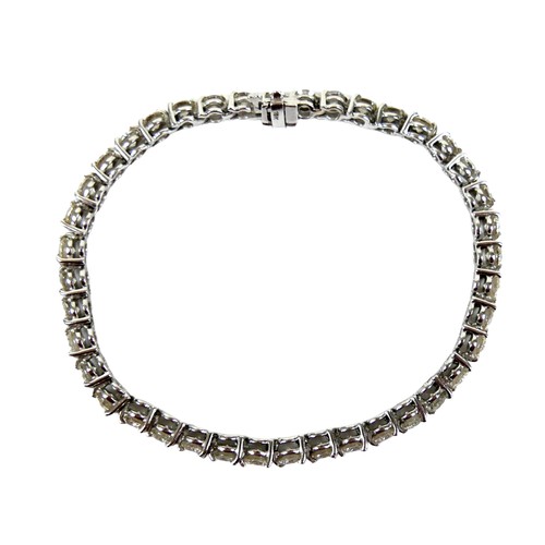 311 - An 18ct white gold and diamond tennis bracelet, set with forty round brilliant cut stones, each appr... 