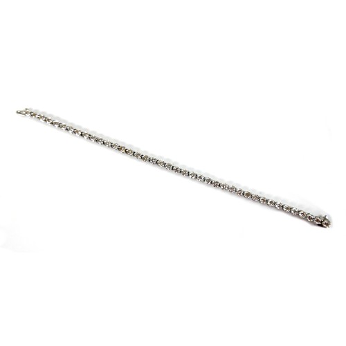 311 - An 18ct white gold and diamond tennis bracelet, set with forty round brilliant cut stones, each appr... 