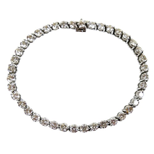 311 - An 18ct white gold and diamond tennis bracelet, set with forty round brilliant cut stones, each appr... 