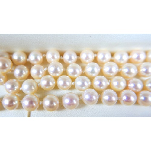 206 - A pearl necklace with an 18ct white gold and diamond clasp, the single string of evenly sized pearls... 