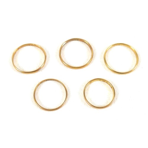 270 - A group of five 22ct yellow gold wedding band rings, 1.7 to 2.3mm wide, sizes I to O, combined weigh... 