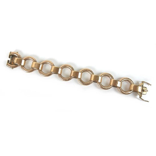 291 - A 9ct yellow gold bracelet, formed of seven oversized rings joined by flattened loops, press clasp w... 