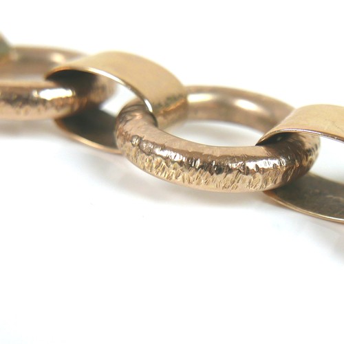 291 - A 9ct yellow gold bracelet, formed of seven oversized rings joined by flattened loops, press clasp w... 