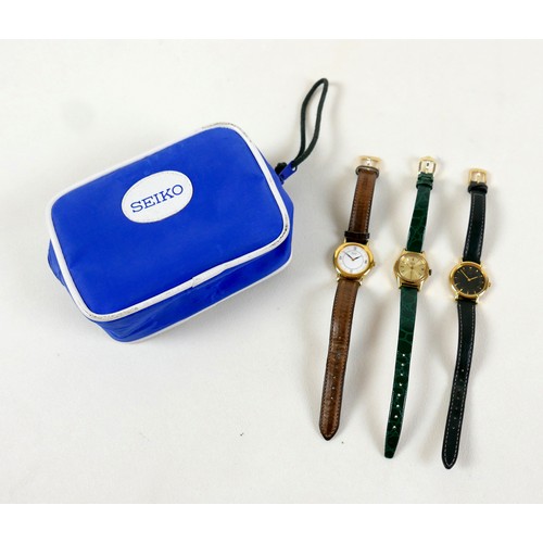 115 - A group of three Seiko lady's wristwatches, with blue Seiko bag. (4)