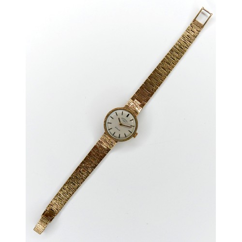 124 - A Rotary 9ct gold cased lady's wristwatch, circa 1960s, circular silvered dial with gold batons, 21 ... 