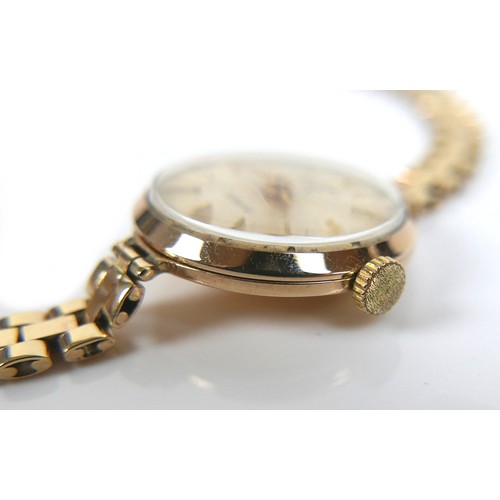 120 - A 9ct gold Rotary lady's wristwatch, circa 1960's, with circular silvered dial, gold batons and hand... 