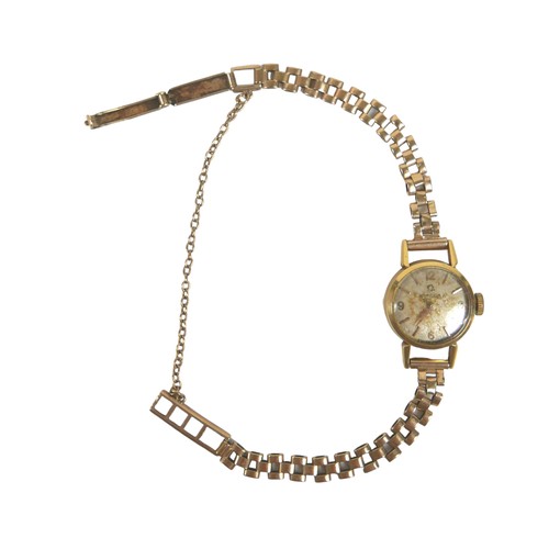 125 - An Omega 9ct gold lady's wristwatch, on a 9ct gold articulated bracelet strap with safety chain, 13.... 