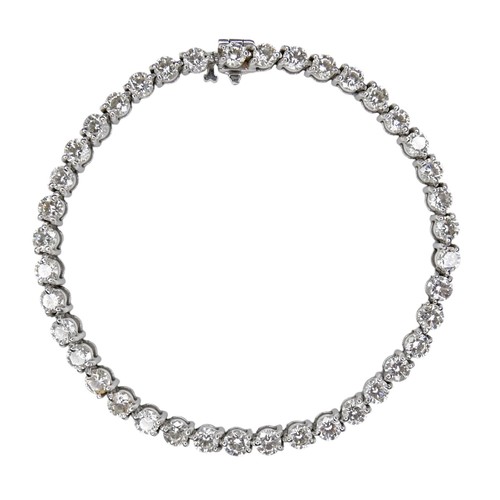An 18ct white gold and diamond tennis bracelet, set with forty round brilliant cut stones, each approximately 0.22ct, 3.9 by 2.4mm, in three claw conjoined settings, press clasp with safety clip, approximately 8.8ct total diamond weight, 4.0mm wide, 19.8cm long, 14.9g.