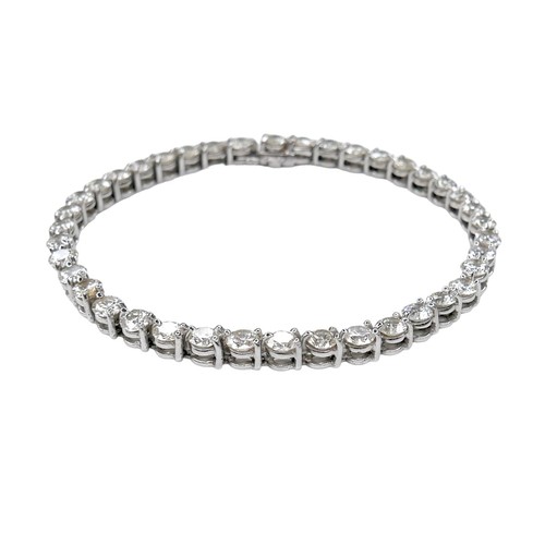 311 - An 18ct white gold and diamond tennis bracelet, set with forty round brilliant cut stones, each appr... 