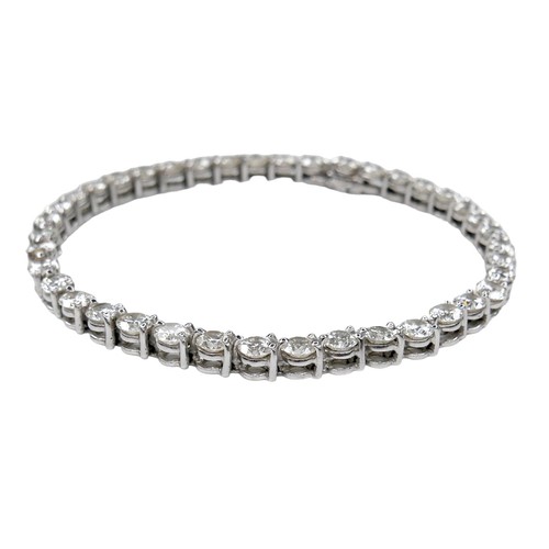 311 - An 18ct white gold and diamond tennis bracelet, set with forty round brilliant cut stones, each appr... 