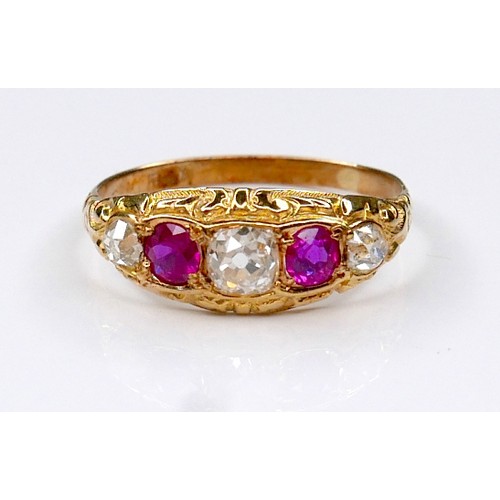 288A - An Edwardian 18ct yellow gold, diamond and ruby five-stone ring, the central oval faceted cut diamon... 