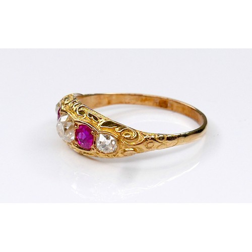 288A - An Edwardian 18ct yellow gold, diamond and ruby five-stone ring, the central oval faceted cut diamon... 