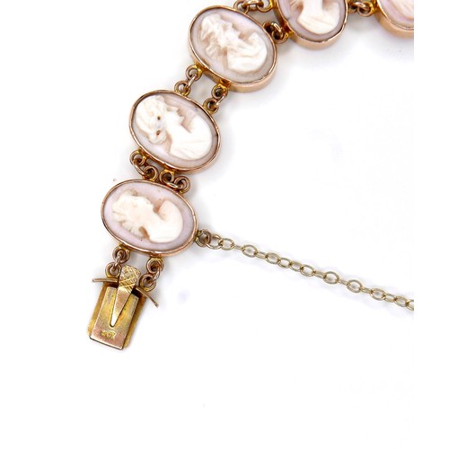 245A - A 9ct yellow gold cameo bracelet, formed of eleven ovals with carved portrait profiles, each 10 by 1... 