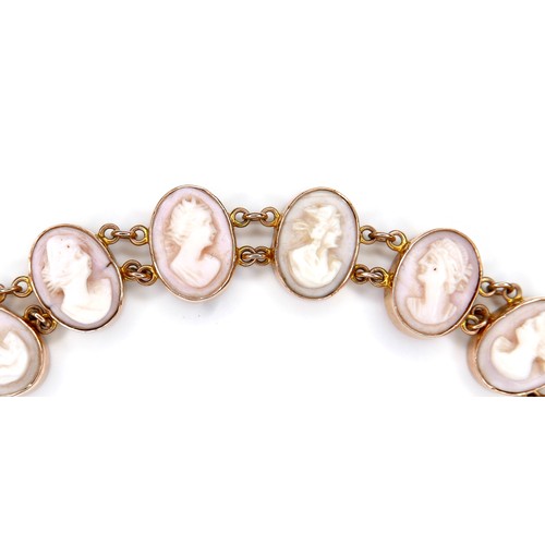 245A - A 9ct yellow gold cameo bracelet, formed of eleven ovals with carved portrait profiles, each 10 by 1... 