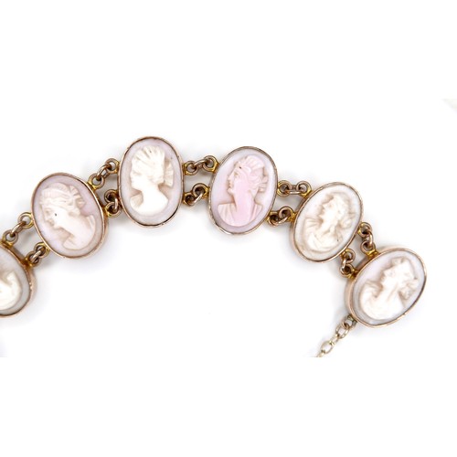 245A - A 9ct yellow gold cameo bracelet, formed of eleven ovals with carved portrait profiles, each 10 by 1... 