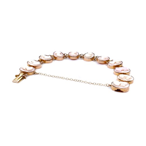 245A - A 9ct yellow gold cameo bracelet, formed of eleven ovals with carved portrait profiles, each 10 by 1... 