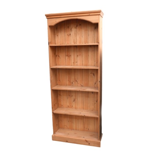 499 - A modern pine bookcase, closed back, plinth base, 78 by 24 by 190cm high.