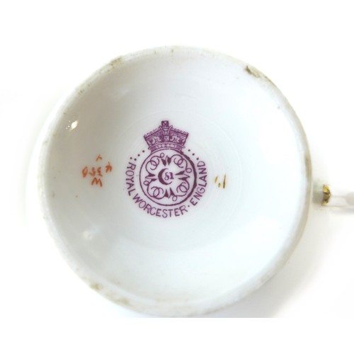 30 - A Royal Worcester part tea service, comprising twelve teacups and saucers, ten side plates, one milk... 
