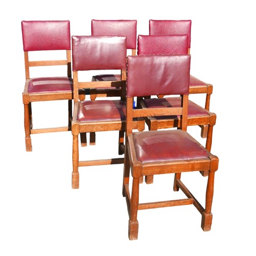 523 - A set of six oak dining chairs, mid 20th century, with burgundy leatherette seats and backs, turned ... 