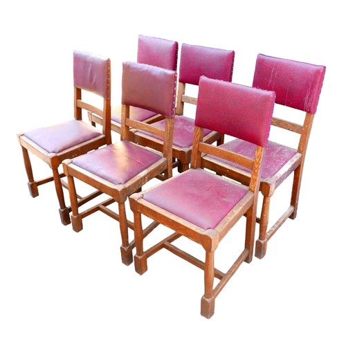 523 - A set of six oak dining chairs, mid 20th century, with burgundy leatherette seats and backs, turned ... 