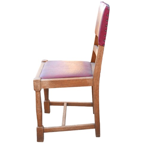 523 - A set of six oak dining chairs, mid 20th century, with burgundy leatherette seats and backs, turned ... 