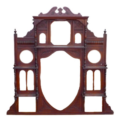 492 - A Victorian mahogany overmantle mirror with central shield shaped bevelled glass, galleried above wi... 