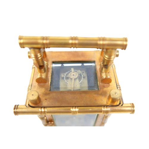 221 - A miniature brass faux bamboo carriage clock with decorative panels 7cm by 5.5cm by 11cm tall with k... 