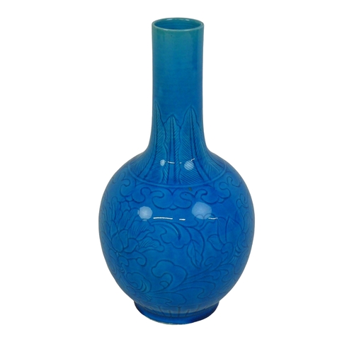 1 - A Chinese porcelain turquoise glazed tianqiuping shaped vase, circa 1960, decorated with incised lea... 