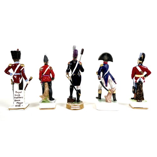 53 - A group of five china figurines, of military interest, including a Goebel 'Officier d'infanterie 181... 
