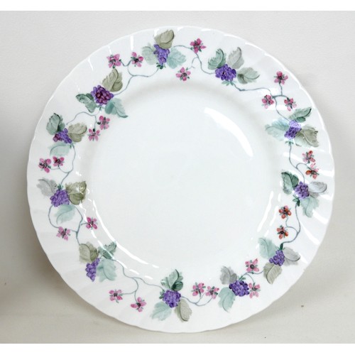 81 - A modern hand painted bone china tea set, decorated with purple flowers and leaves, each signed 'Han... 