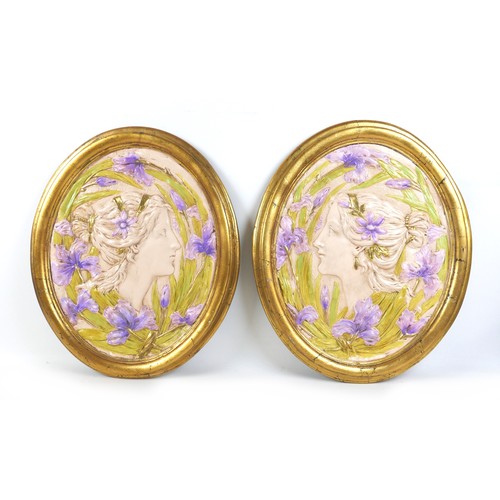 456 - Two Art Nouveau style wall plaques, late 20th century, depicting two female profiles, with gold oval... 