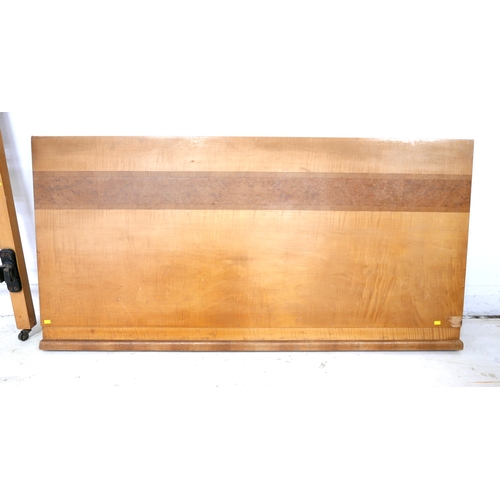 493 - An Art Deco double bed headboard, 137 by 126cm, and footboard, 137 by 58cm, maple and burr walnut ve... 