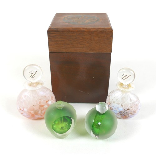 180 - A group of four unusual glass perfume bottles, two green and gold prototypes, and two mottled white ... 