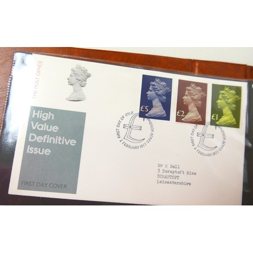 202 - A collection Royal Mail first day covers and royal commemorative coins, 1970’s onward, including Gue... 