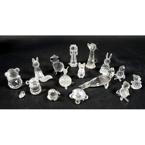 176 - A collection of fifteen Swarovski animal figurines, including a panda, a seals, teddy bears, a snail... 