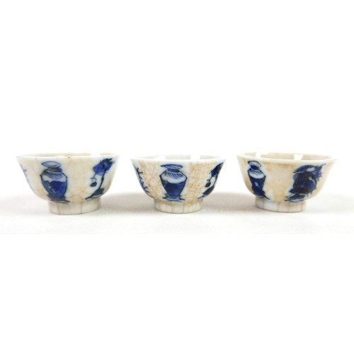 14 - Three blue and white crackle glaze wine cups, 3cm tall, signed to bases