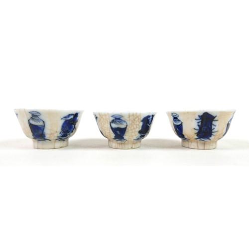 14 - Three blue and white crackle glaze wine cups, 3cm tall, signed to bases