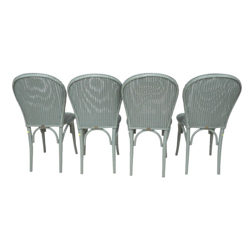 554 - A modern Lloyd Loom Bistro set, green painted wicker, comprising a table with circular glass top, 76... 