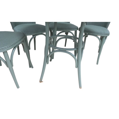 554 - A modern Lloyd Loom Bistro set, green painted wicker, comprising a table with circular glass top, 76... 