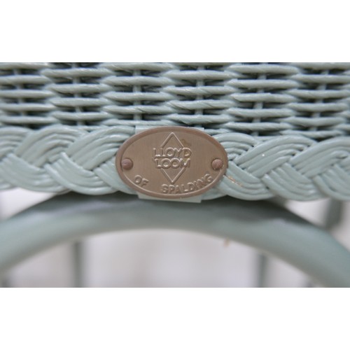 554 - A modern Lloyd Loom Bistro set, green painted wicker, comprising a table with circular glass top, 76... 