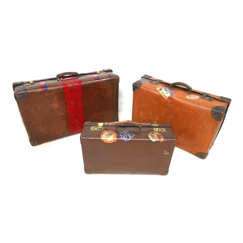 309 - Three vintage fibre suitcases with interesting labels. (3)