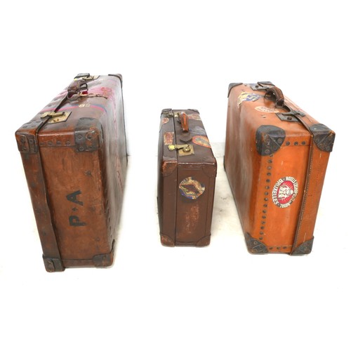 309 - Three vintage fibre suitcases with interesting labels. (3)