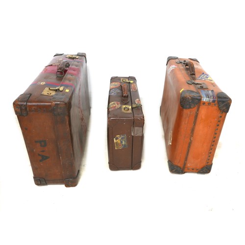 309 - Three vintage fibre suitcases with interesting labels. (3)